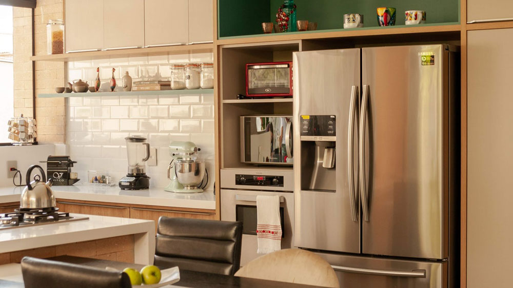 A kitchen with a large french door refrigerator