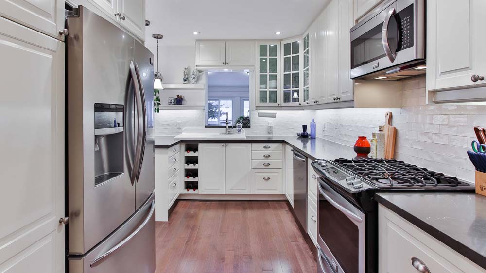 A kitchen with an assortment of new home appliances