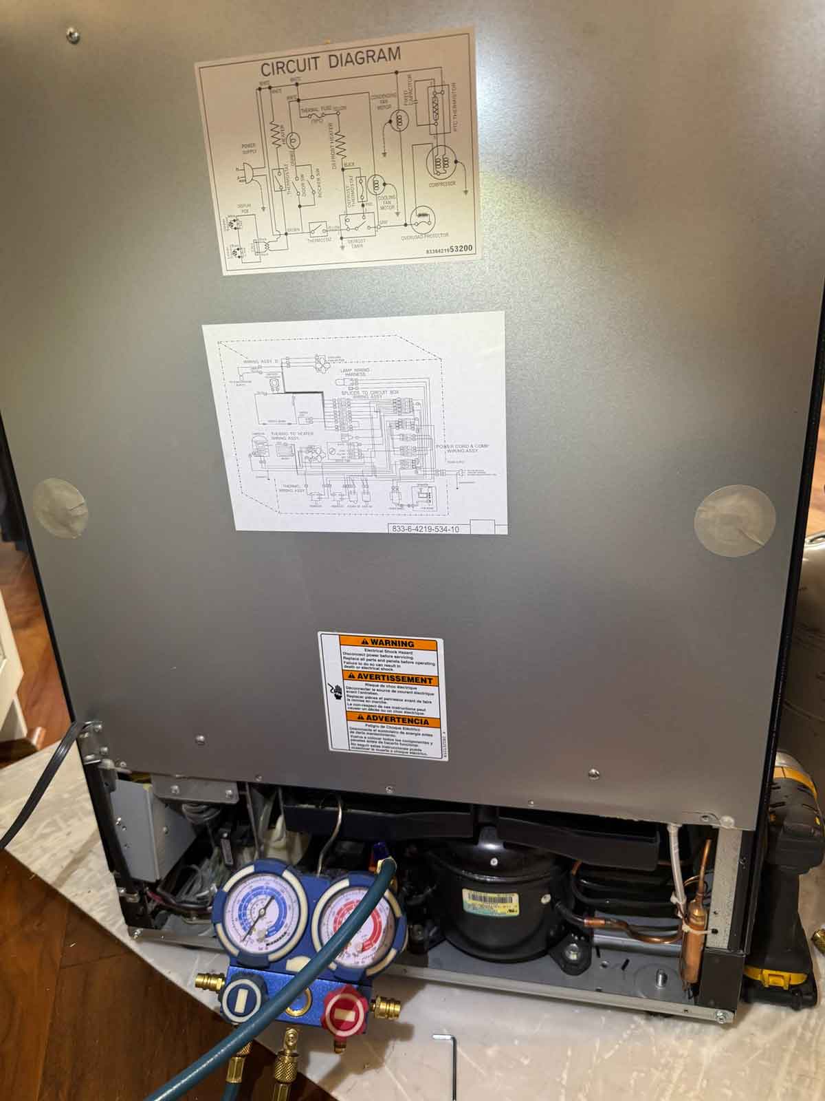 KitchenAid wine cooler as viewed from the back, mid-repair